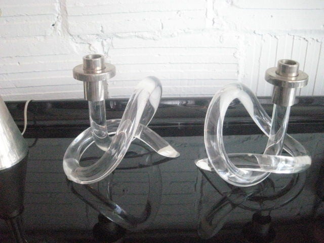 Pair of lucite and nickel candle sticks in twisted pretzel form.