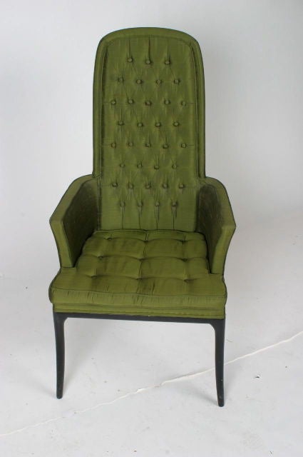 Tufted back and seat tall back chair with ebony saber legs, label. Measures: Arm height 25