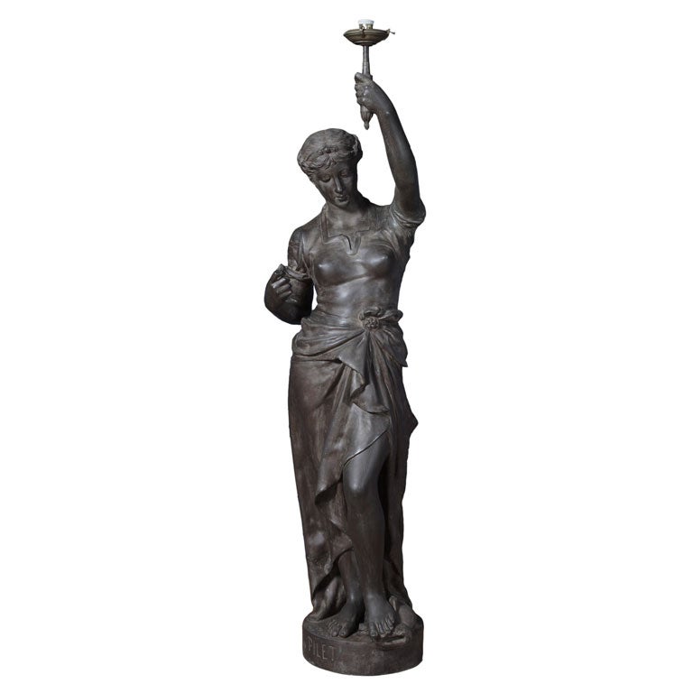 STATUE/TORCHIERE OF A HEROIC MAIDEN