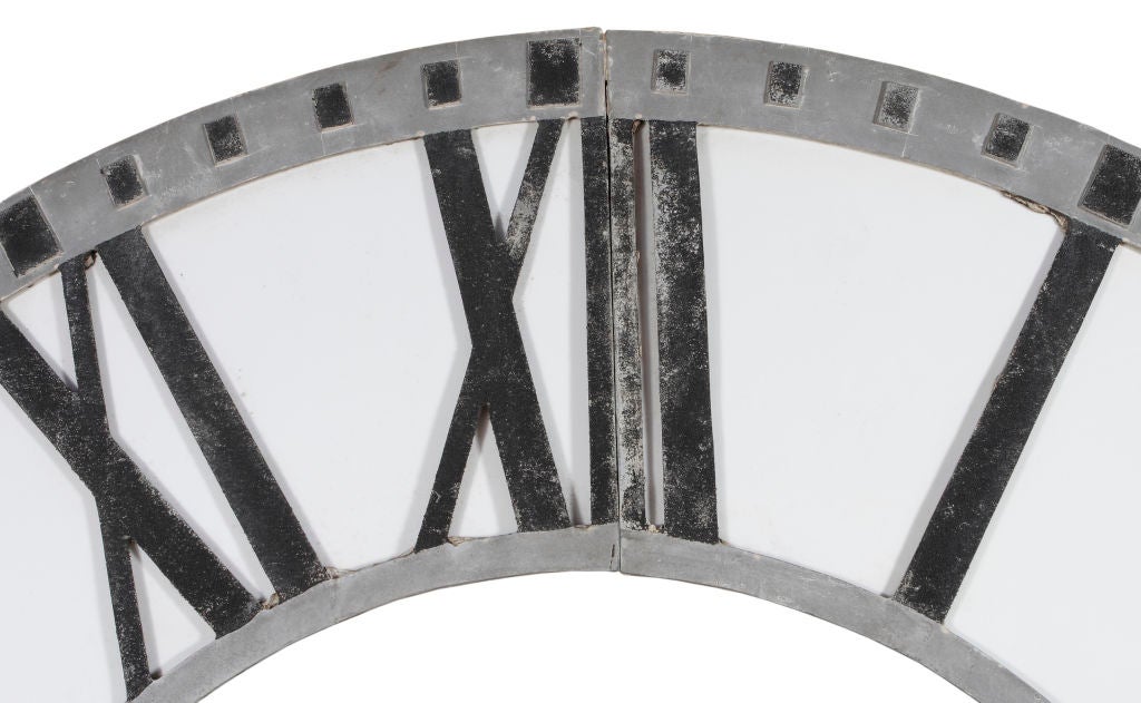 American circa 1930 cast aluminum and glass Roman numeral clock face of considerable size.