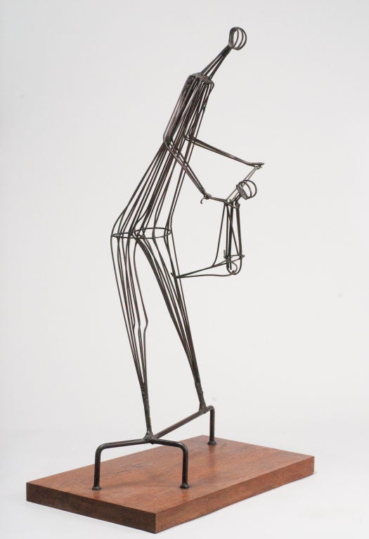 Playful kinetic wrought iron sculpture on wood base, by Robert Kuntz, depicting a child swinging from parent's arms.

Robert Kuntz studied at the Art Institute of Chicago, Contemporary Art Workshop, Chicago, and Indiana University at South Bend.
