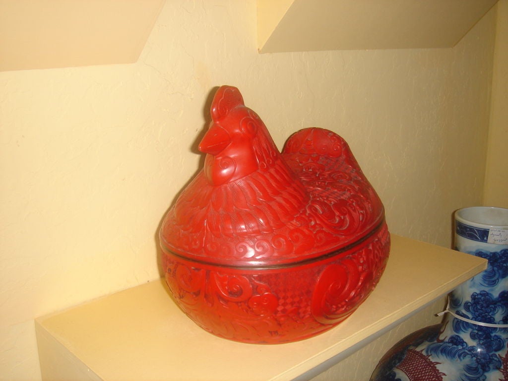 A Wonderful Cinnabar Box in the shape of a Hen opens in the middle well carved black lacquered in size