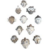 Collection of 11 clay african miniature masks