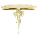 Carved wood elephant deminlune table