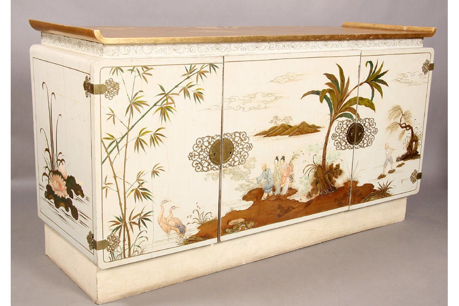 Modern James Mont style sideboard with gilt top, three doors with Chinoiserie and platform base circa 1960.
