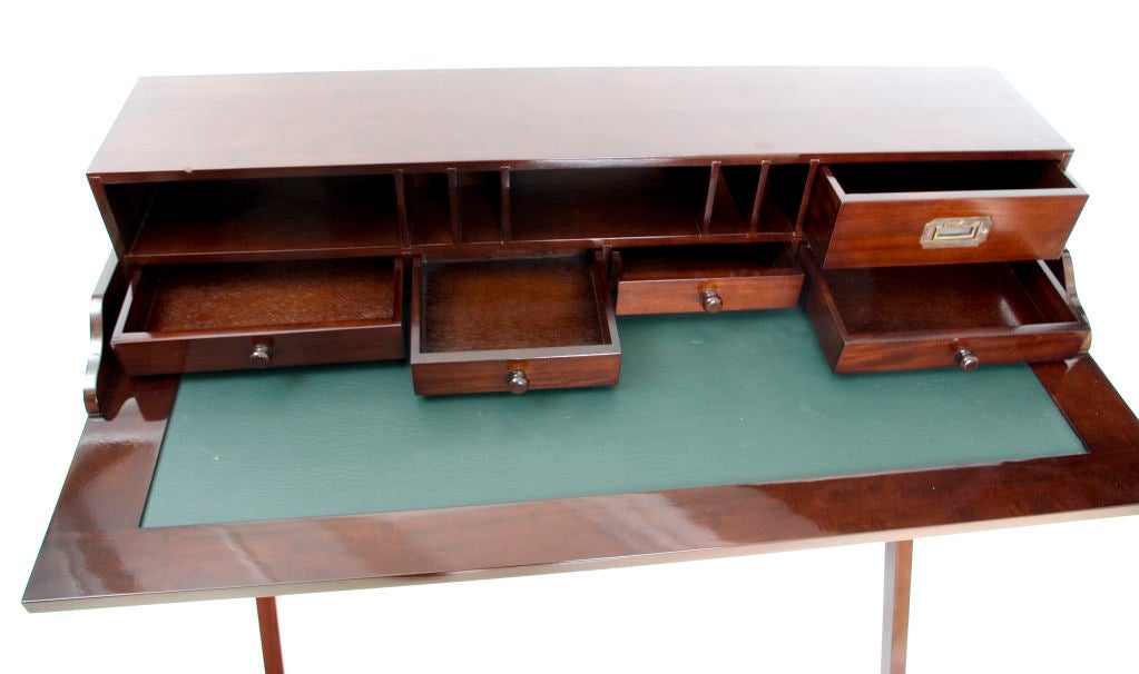 Very cool writing table with removable top piece full of drawers, openings etc. Legs collapse for easy storage.