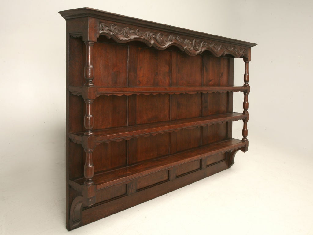Charming hand-carved wooden-peg constructed Country French plate rack made from oak with groves for plates.