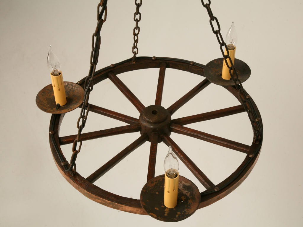 Vintage French 3 light chandelier made from a hand-carved rustic wagon wheel with original copper banding. Wonderful patina!<br />
<br />
There is another matching wagon wheel chandelier-one chandelier is  $790. If you want both the price is $1290