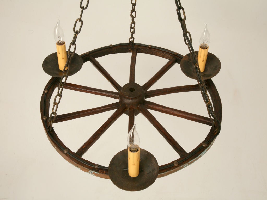 Vintage French 3 light chandelier made from a hand-carved rustic wagon wheel with original copper banding. Wonderful patina!<br />
<br />
There is another matching wagon wheel chandelier-one chandelier is $790. If you want both the price is $1290