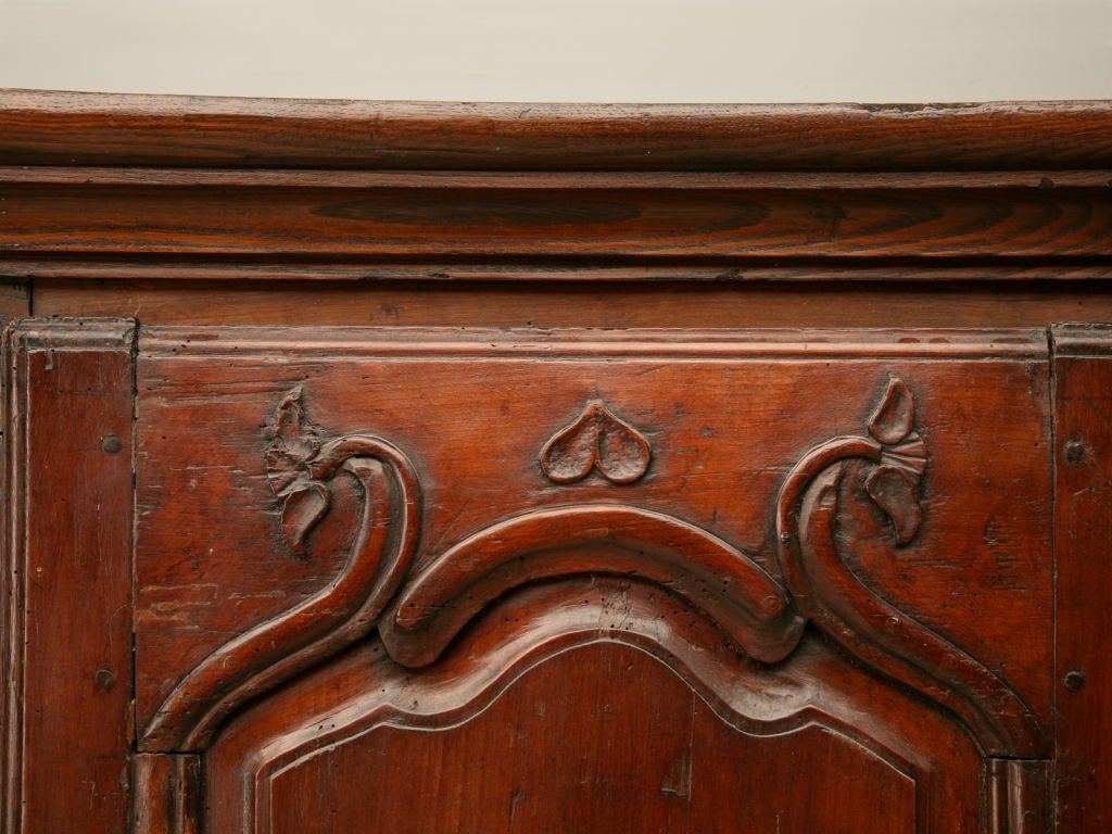 Unbelievable French Louis XV bonnetiere with unique ribbed corners. Made from oak, chestnut and walnut with a spectacular cherrywood door. Truly special!!<br />
<br />
The length and depth below are for the crown. The body is 26