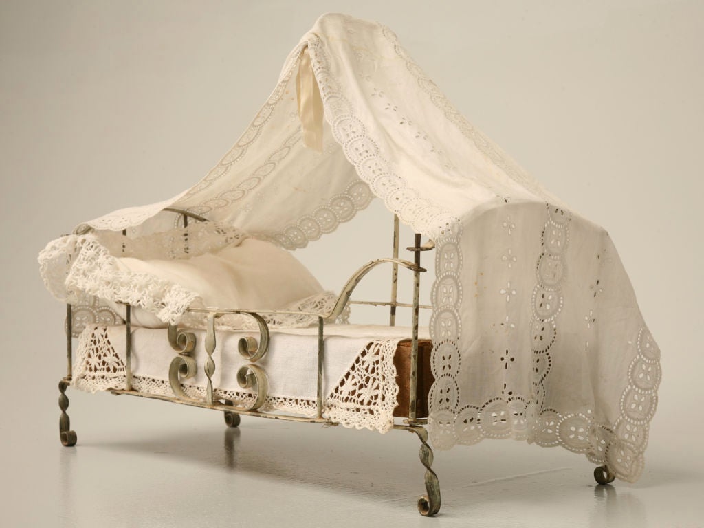 Charming hand-formed French metal canopy bed with its original putty paint and lace trimmed fabric-- for the doll/dog that deserves nothing but the very best!!!<br />
<br />
The first height is for the canopy hook. The second height is the head