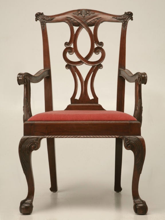 Gorgeous authentic antique Irish hand carved walnut Chippendale armchair, with newer mohair upholstery. Outstanding carved legs takes this chair up another notch. This is about as nice an antique hand-carved Chippendale style arm chair as we have