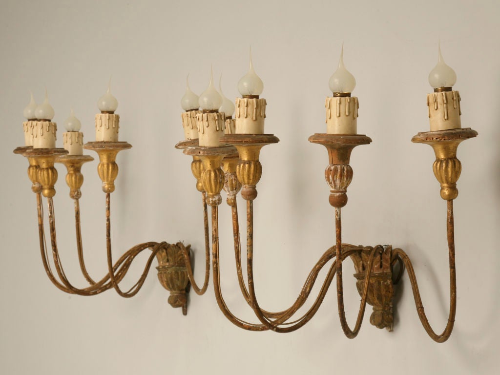 Outrageous pair of original 18th century Italian handcarved and gilded wood sconces. They have been completely rewired by our in-house electrician. You really DO deserve the best!!