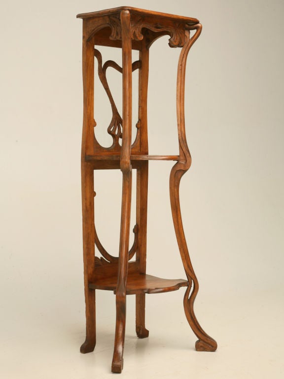 Unbelievable circa 1890 hand-carved French walnut Art Nouveau etagere, Graceful and flowing lines are what set Art Nouveau style apart from any other. This exquisite piece has 3 shelves, a sensuous carved frame, and is an excellent example of fine