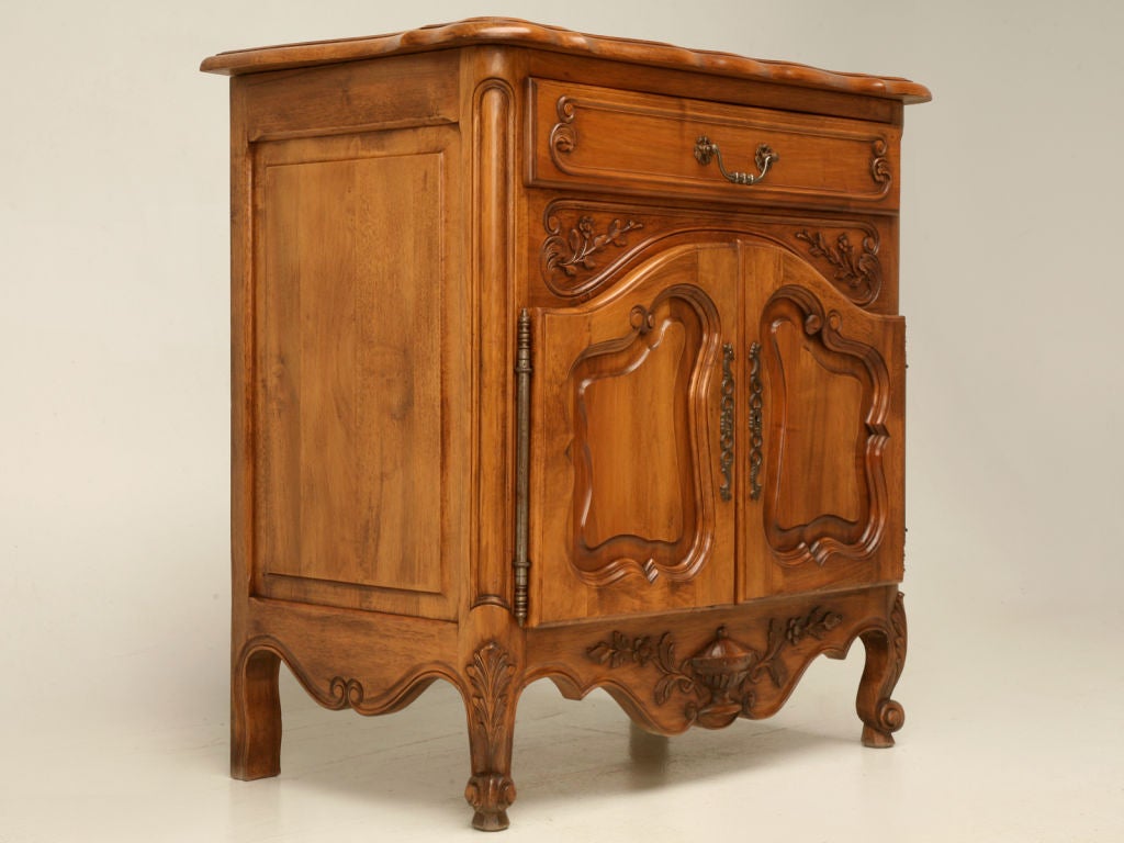 Petite French Louis XV style cupboard. Small cupboards are sometimes servers in the dining room, a nightstand in the bedroom, or a sink-base in ones powder room; this is a nifty cabinet. In the fashion of Louis XV, it has sharp carvings, raised