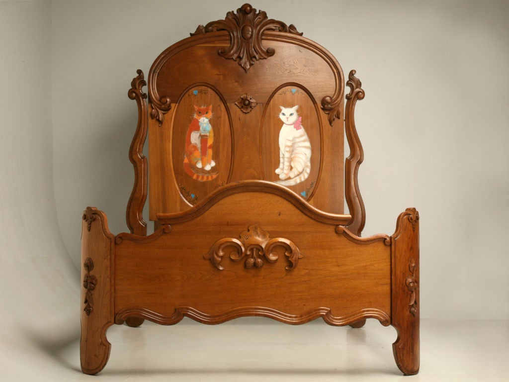 The Kitties are here, looking for a young lady to watch over each night. Decorated with walnuts, this amazing Antique Victorian Bed was made using some of the most beautiful woods available at the time, Oak, Walnut, and Elm. During the last quarter