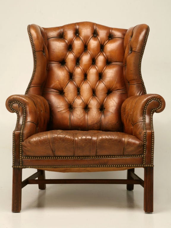 Beautiful, refined, straight legged, English Chippendale, winged back library chair-- This fine chair was obviously well loved by it's previous owner, as it's leather upholstery has a warm Ralph Lauren appearance. This fabulous chair would be