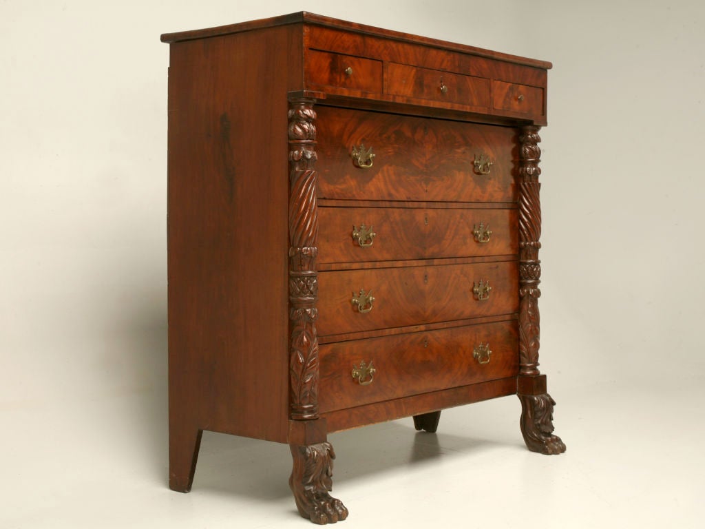 This is it!!! This elaborate American Empire chest of drawers is the one you've been waiting for. Breathtaking crotch mahogany 3 over 4 gentleman's chest with highly decorated pillars ending in large paw feet. This amazing chest has obviously been