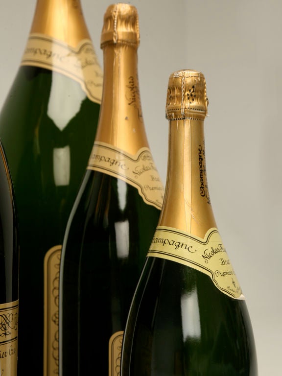 Set of six store props made by the manufacturer to be used to advertise the different sizes of Champagne available. Included are; Jeroboam, Methuselah, Salmanazar, Magnum, Nebuchadnezzar and Balthazar. Nicolas Feuillatte created his brand in 1976,