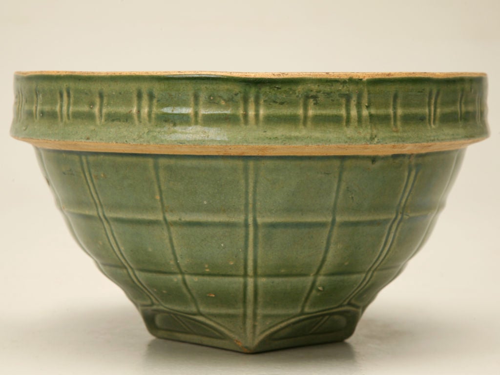 Made of stoneware and glazed green with a pattern of squares, we offer you this neat mixing bowl. Interesting as a kitchen prop or displayed as a whole collection as shown in photo #10.