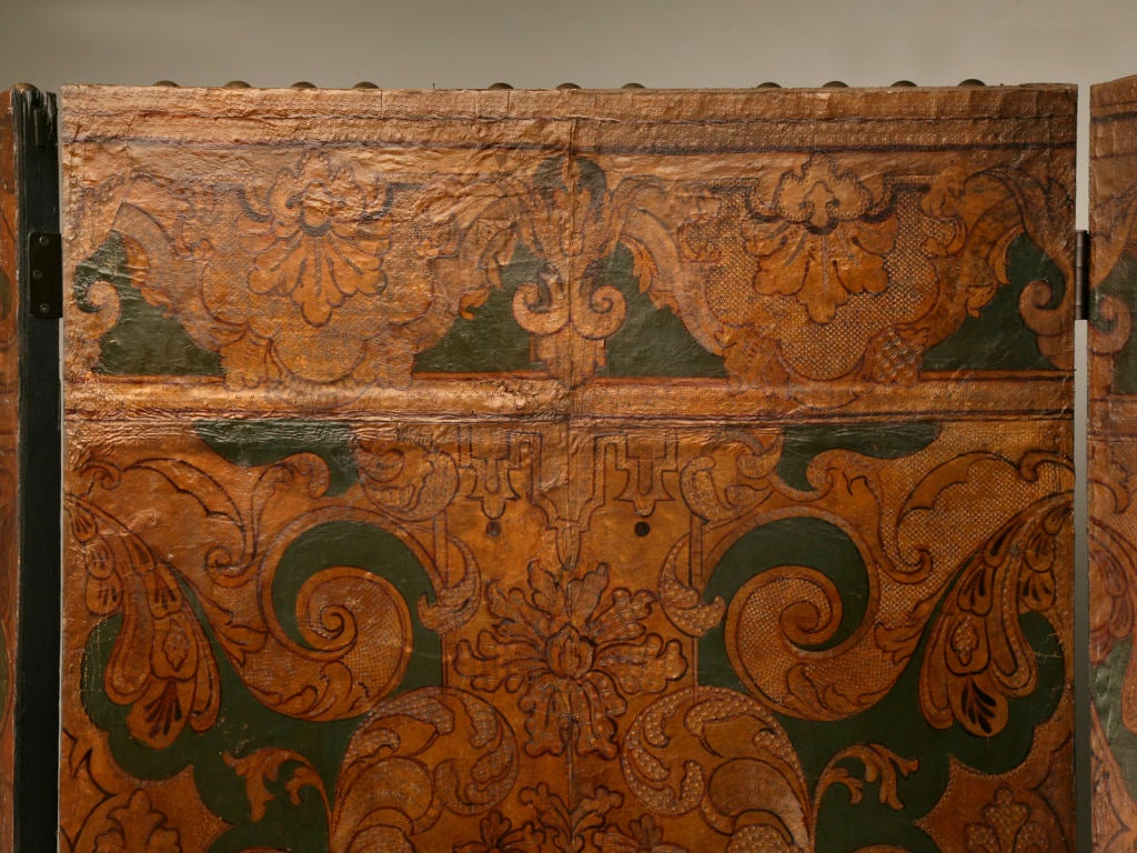 Stunning 18th century folding gilt, painted and tooled leather screen from Mechelen. Mechelen (Belgium) was a major European production center of gilt, tooled and embossed leathers in the 17th and 18th centuries--The major handicraft center for