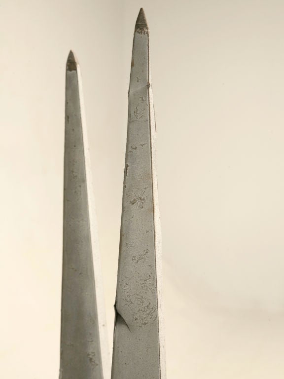 Pair of antique French zinc architectural roof-top spire-form finials. In the 18th century, zinc became a popular roofing material in Belgium and France. Throughout the 18th and 19th centuries, zinc was also molded into other architectural forms,