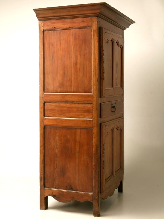 French Louis XV style cherry bonnetiere with full steel hinges, beautiful steel escutcheons and a hand-dovetailed drawer. The front and sides are solid cherry which is unusual and means it is high quality (cherry was rare and reserved for the front