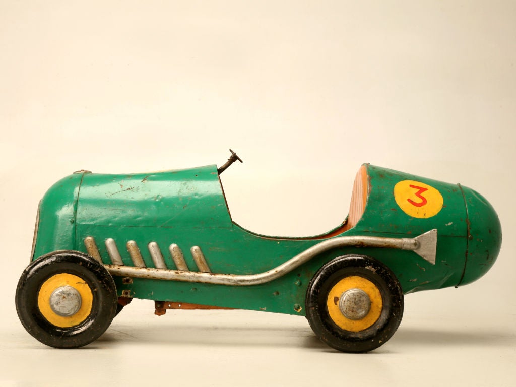 Fantastic vintage French toy pedal car in the form of a racer, that would make an excellent prop for a child's room, or a great toy restored with a steering wheel. Picture your child being the only one on the block with his very own French race car.