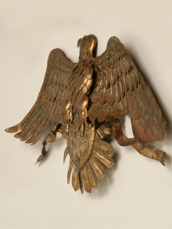 Wonderful highly stylized vintage American copper folk art style eagle wall decoration. Perfectly suited for a fireplace, a brick or stone wall or really just about anywhere, either indoors or out. Let this great eagle adorn your space with style