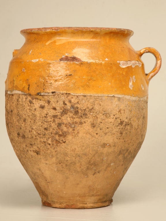 Pots de confit were used primarily in the South of France for the preservation of meats such as duck or goose for dishes such as cassoulet or foie gras. The bottom halves were left unglazed, due to the fact that the pots were half buried in the