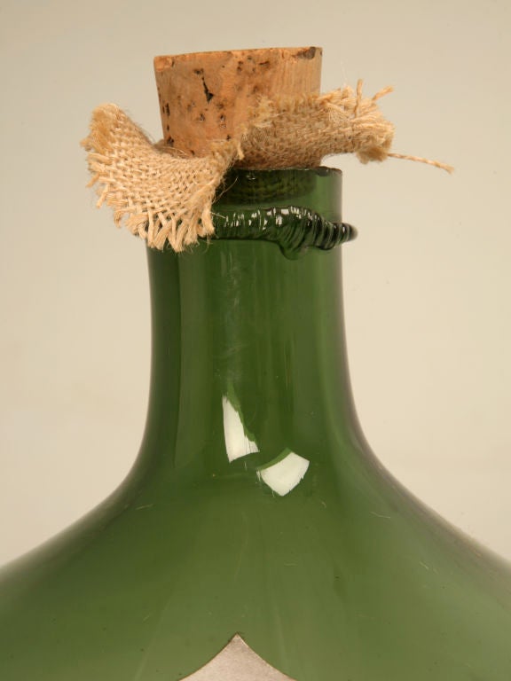 Vintage French mouth-blown glass wine bottle with reproduction Vin de Blagny label. These are great kitchen or wine cellar props, the color and the irregularities in the glass are amazing.