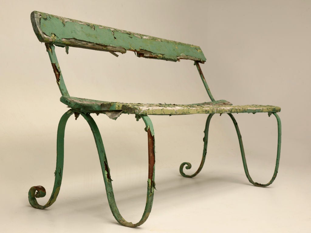 Wonderful old English park bench with a flowing iron frame and fabulous crumbly green paint. Ready to place under a tree to enjoy the breathtaking views, while enjoying a cup of tea, and great stimulating conversation, even if it's with yourself.