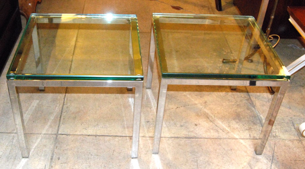 Pair of chrome finish side tables with glass top