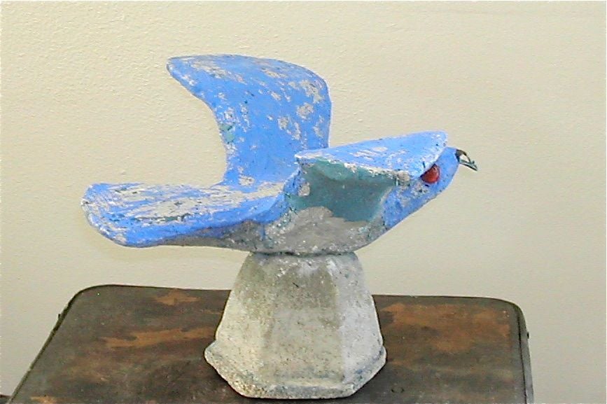 A PFALTZGRAFF BLUE BIRD IN FLIGHT. This self based example from a collection of birds is finished in a  with glass eyes  bright blue paint along with the trademark glass eyes.<br />
One of several birds in flight.