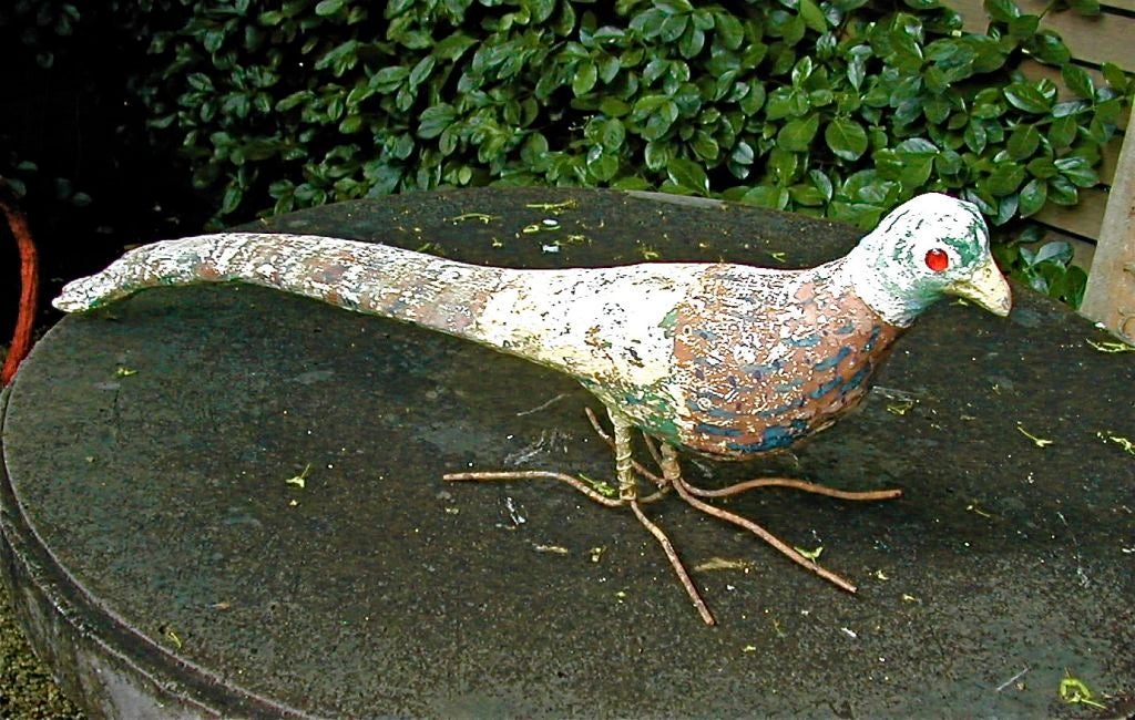 Another Pfaltzgraff Pheasant from a collection of Adam Pfaltzgraff's folk art animal series. This specimen bears the signature glass eyes and retains much of the original painted surface.