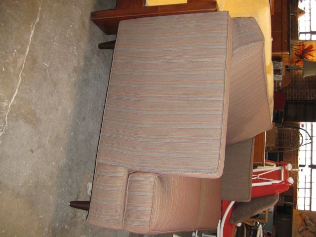 Upholstered in fine textured striped fabric with a hint of blue and red.  Clean lines and simple legs make this love seat perfect for any space.
