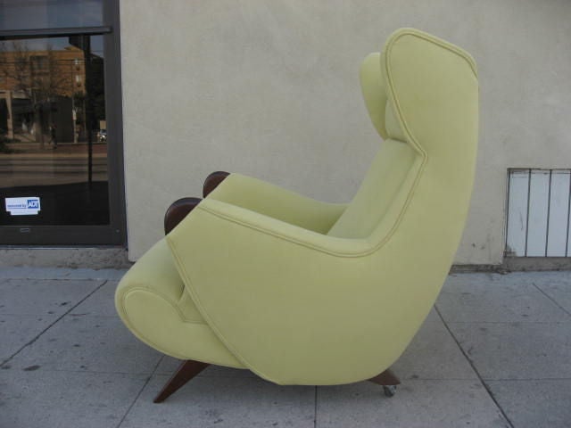 Simply stunning pair of lime green Erton chairs. High back, reclined seat position and scoop back design makes these chairs exceptionally comfortable. Back legs are on wheels. The matching couch is available. The wheels are optional. They existed on