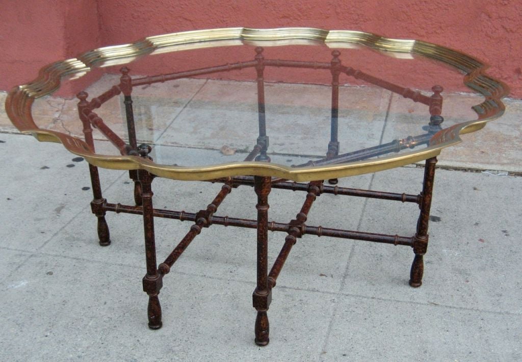 Dramatic brass framed glass top table on Tortoiseshell lacquered faux bamboo base from the Far East Collection by Baker Furniture.