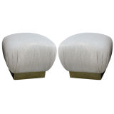 Pair of brass footed poufs in the style of Karl Springer