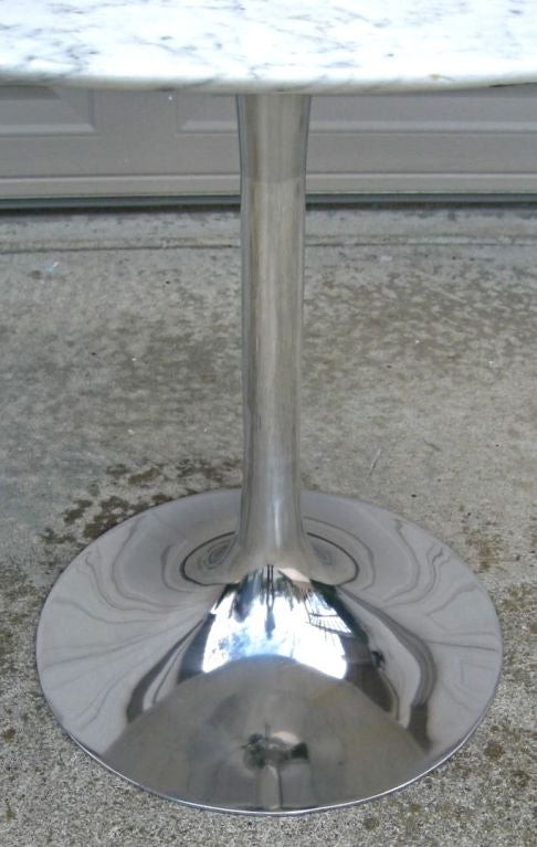 Tulip base table with polished aluminum base in the style of Saarinen.  Freshly polished base with knife edge Carrara Marble top.