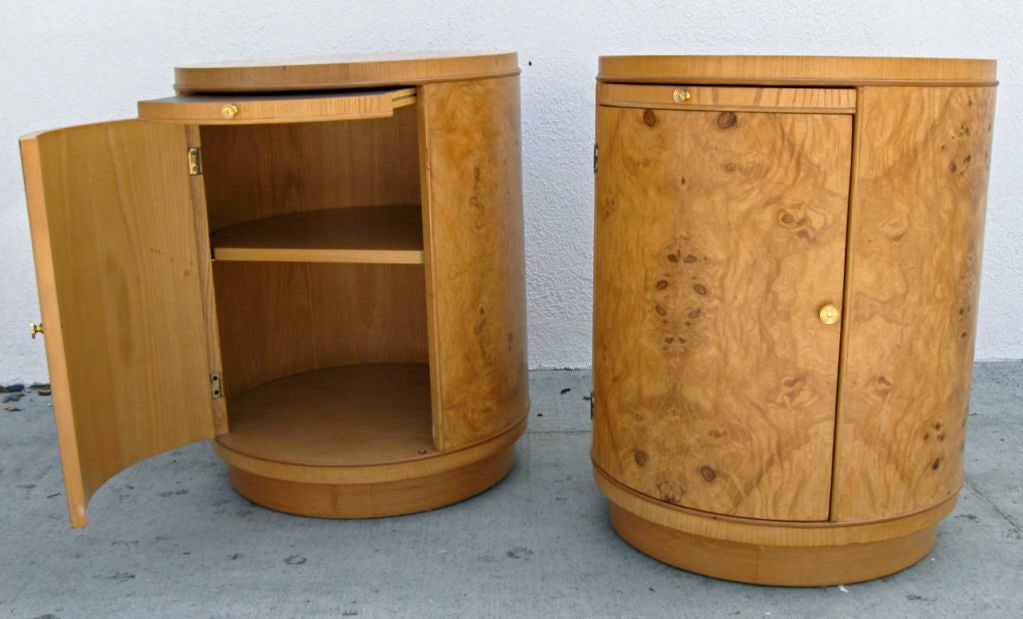 Pair of Bookmatched Olive Burl Drum Cabinets with laminate top pull-out shelf.