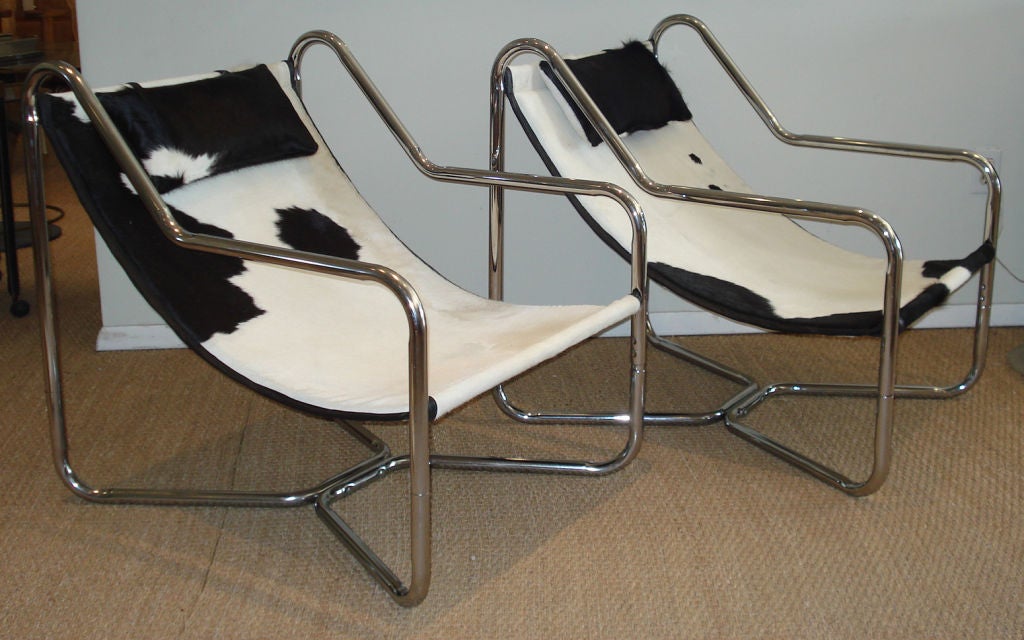 Chrome tubular sling chairs, newly upholstered with cowhide.