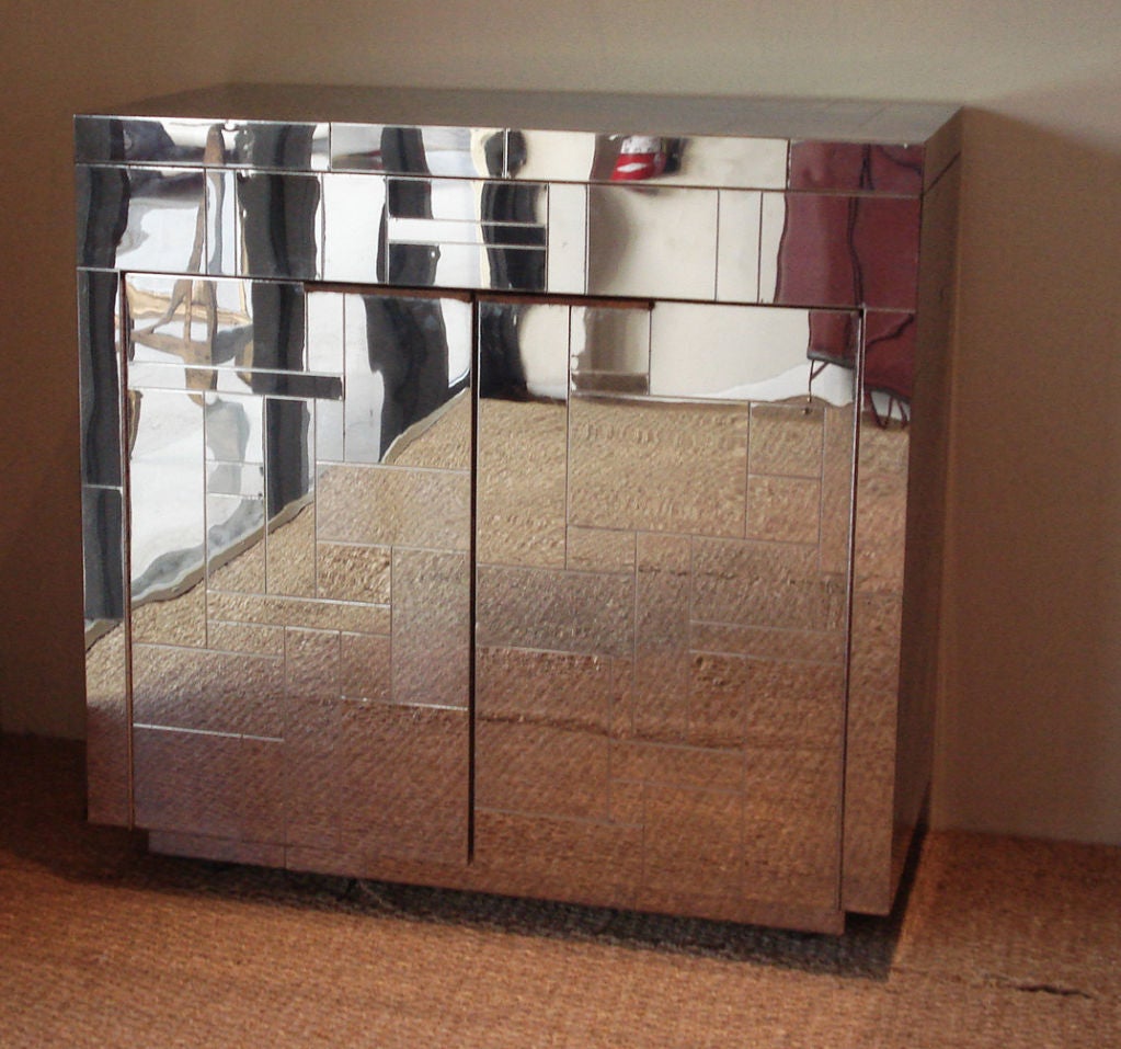 Great, wrapped around patchwork chrome Cityscape cabinet/bar, by Paul Evans. Cabinet/bar glides on casters.<br />
Marked 