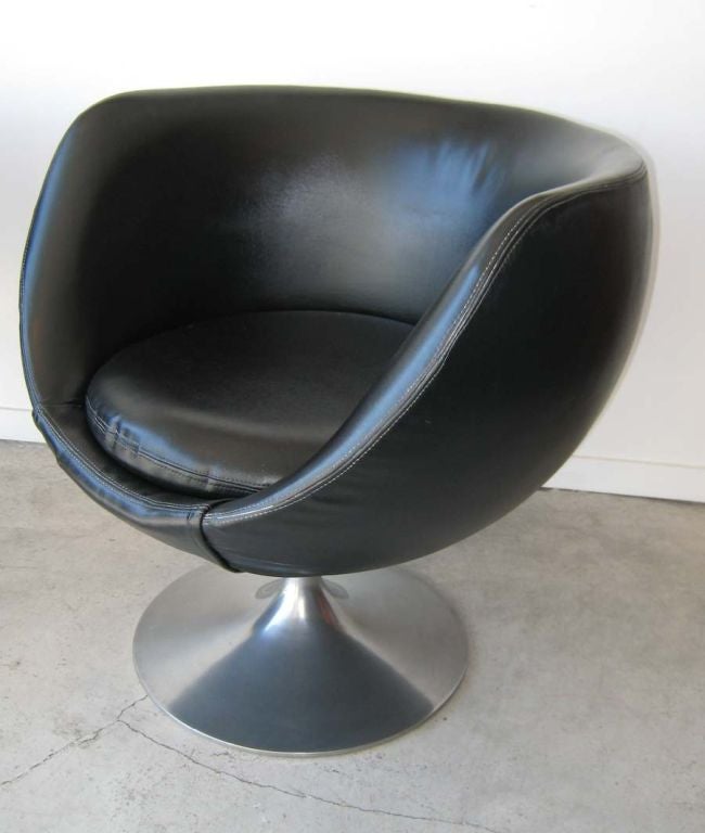 BLACK FAUX LEATHER UPHOLSTERY,ALUMINUM PEDESTAL BASE,CHAIRS SWIVEL.PRICED FOR PAIR.