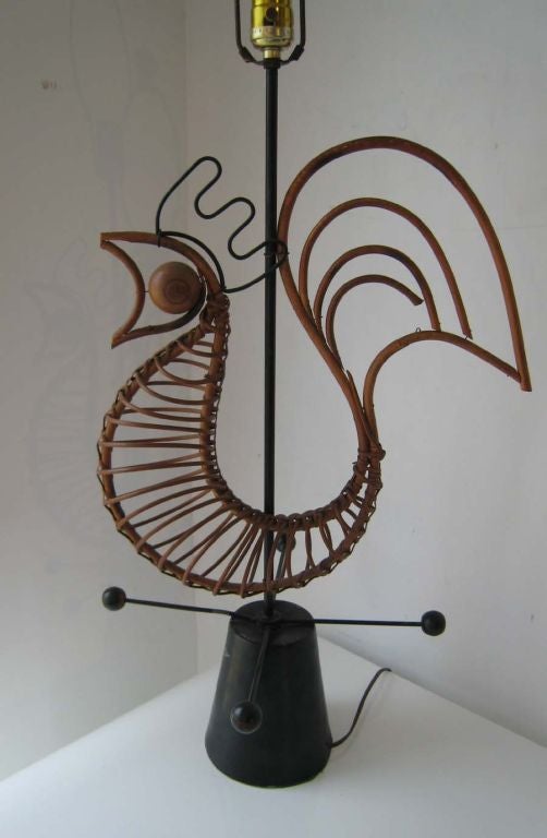 Metal base and internal frame painted black fin. Rattan sculptural rooster and wood ball accents and finials . Electrical is original and working . Lamps are in original as found condition.
