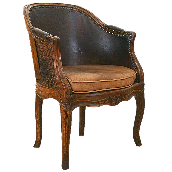 Louis XV Period Walnut, Caned, and Leather Upholstered Bergere