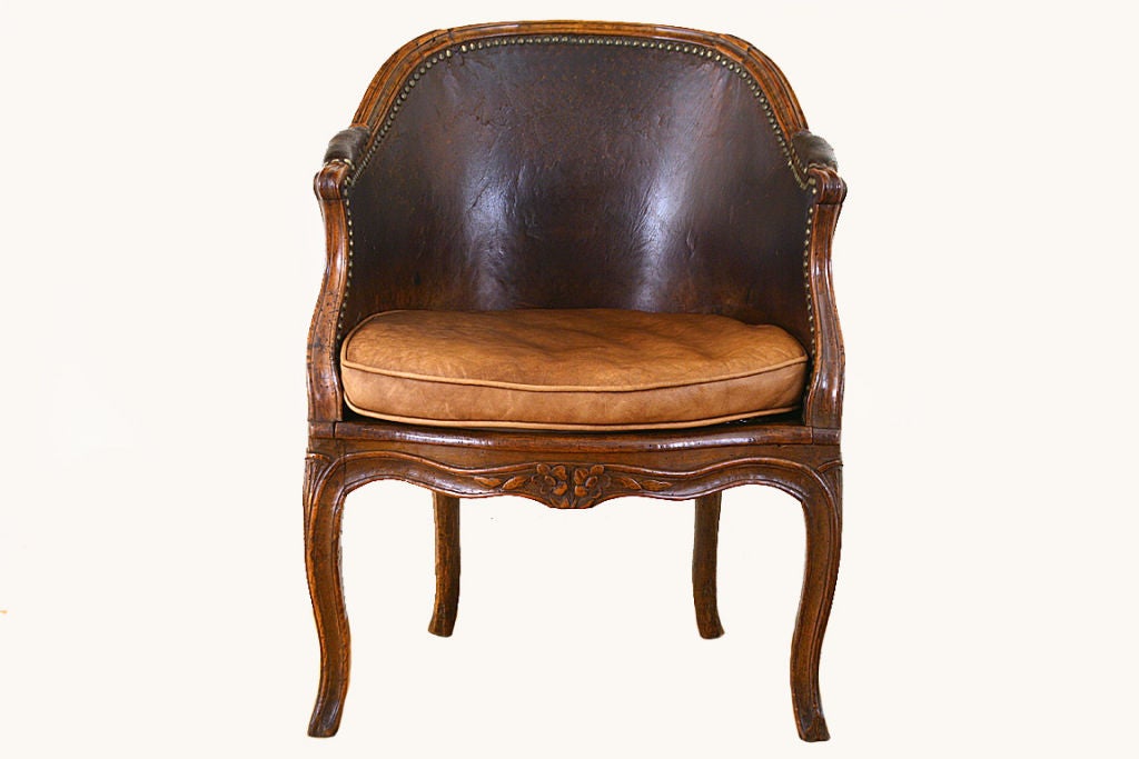 French Louis XV Period Walnut, Caned, and Leather Upholstered Bergere