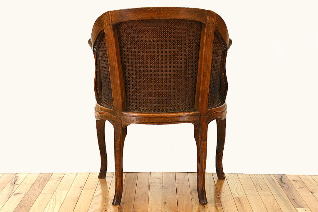 Louis XV Period Walnut, Caned, and Leather Upholstered Bergere 1