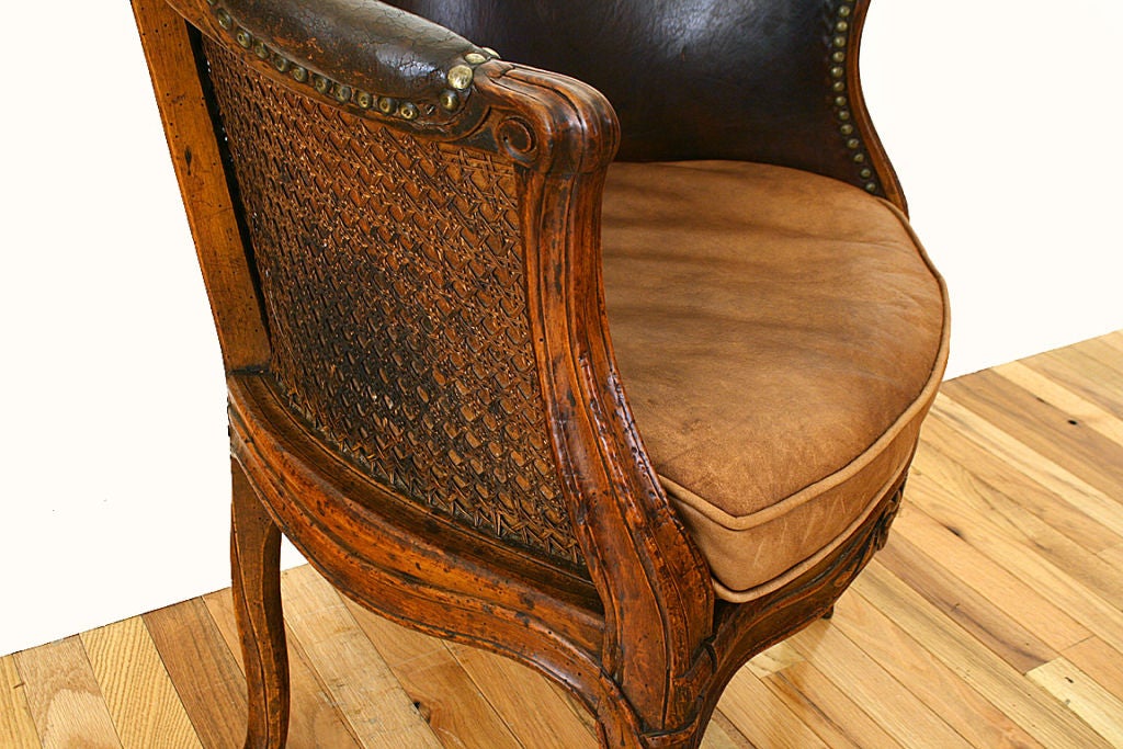 Louis XV Period Walnut, Caned, and Leather Upholstered Bergere 2