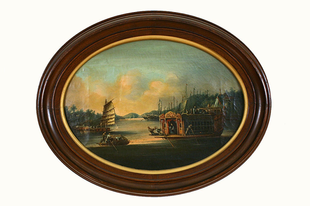 Set within original walnut gilt lined mahogany oval frames the paintings which were painted for the English market depict harbour scenes, one of an expensive rowed vessel with junks in the background, the other of an enormous sailing vessel with
